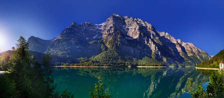 Swiss mountains and lake. Scenic Alps and lane view. Trekking and outdoor lifestyleの写真素材