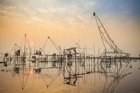 Fishing flattering,Tuek Sadung   in thailand ,on sunriseの写真素材