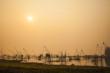 Fishing flattering,Tuek Sadung   in thailand ,on sunriseの写真素材