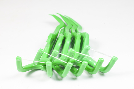 floss toothpick  on white background.の写真素材