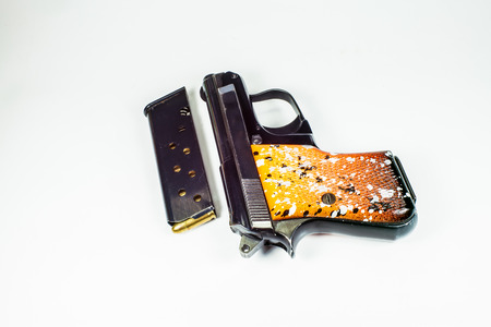 6 35 mm handgun in a leather holster isolated on white の写真素材