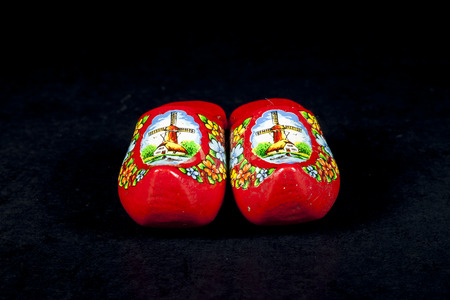 wooden shoes from the Netherlands isolated on black の写真素材