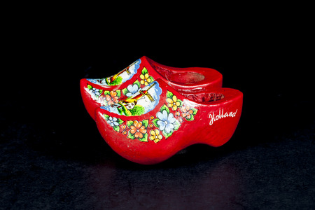 wooden shoes from the Netherlands isolated on black の写真素材