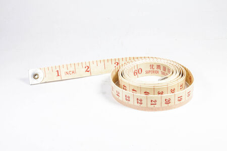 Measuring tape on white backgroundの写真素材