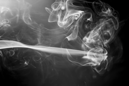 colorful  smoke on black backgroundの写真素材