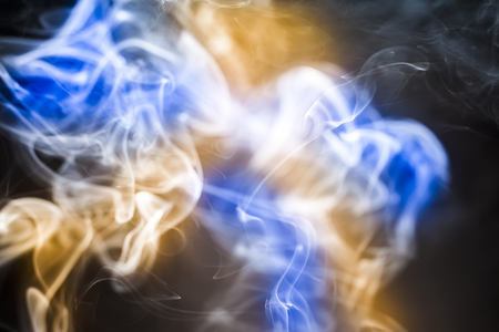 colorful  smoke on black backgroundの写真素材
