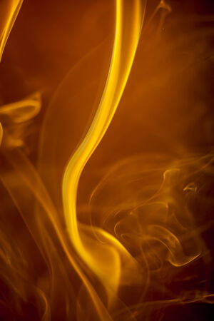 Gold smoke on black backgroundの写真素材