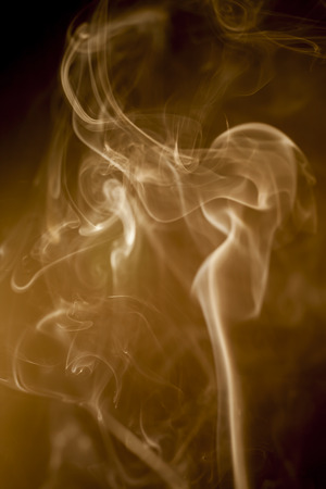 colorful  smoke on black backgroundの写真素材