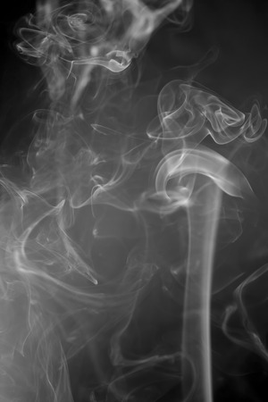 White  smoke on black backgroundの写真素材
