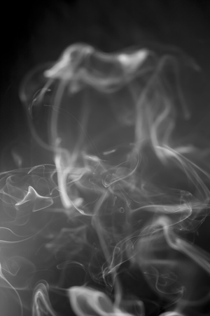 White  smoke on black backgroundの写真素材