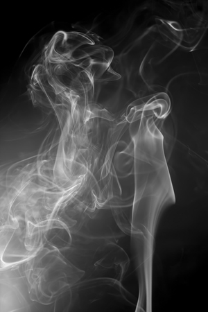 White smoke on black backgroundの写真素材