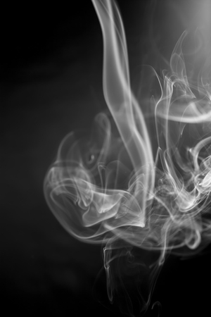 White smoke on black backgroundの写真素材