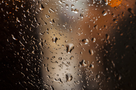 rain drops on glass with a  beautiful backgroundの写真素材