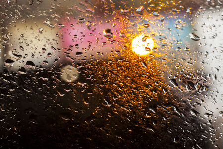 rain drops on glass with a  beautiful backgroundの写真素材