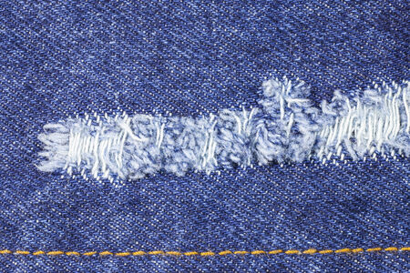 Blue torn denim jeans texture