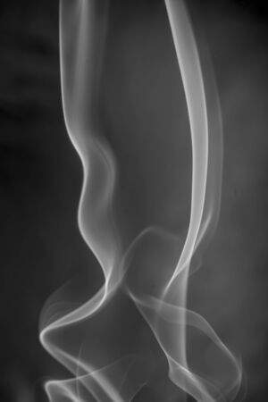 White smoke on black backgroundの写真素材