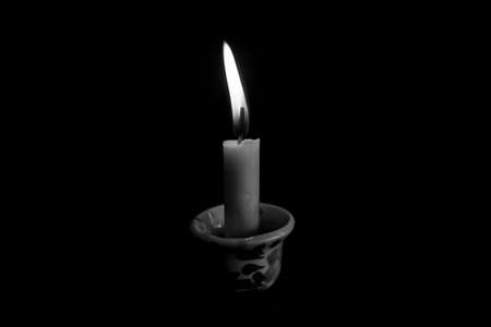 Single candle in the Darkの写真素材