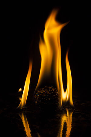 Fire flames on black backgroundの写真素材