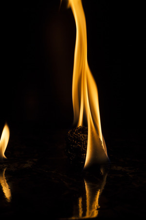 Fire flames on black backgroundの写真素材