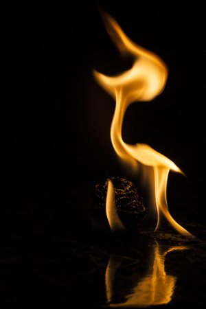 Fire flames on black backgroundの写真素材