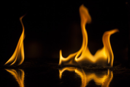 Fire flames on black backgroundの写真素材