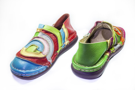 Bright multicolored leather shoes on a white background.の写真素材