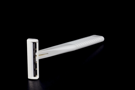 shaving razor on a black background.の写真素材