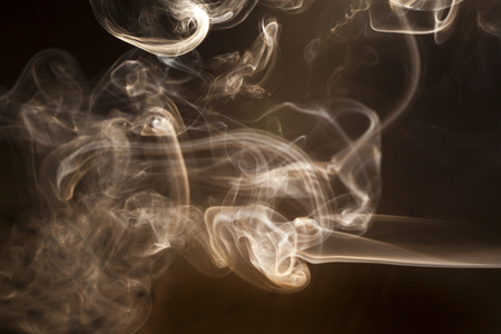 White smoke on black backgroundの写真素材