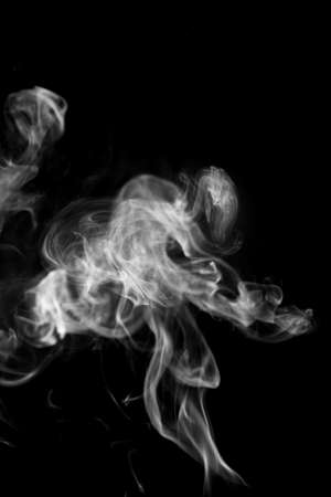 White smoke on black backgroundの写真素材