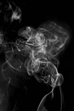 White smoke on black backgroundの写真素材