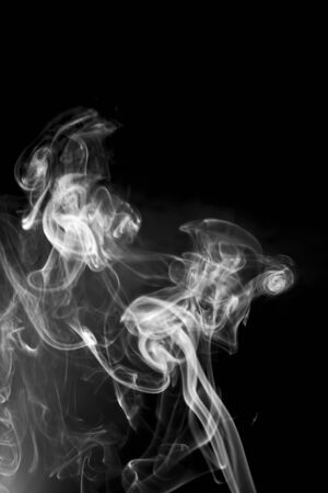 White smoke on black backgroundの写真素材