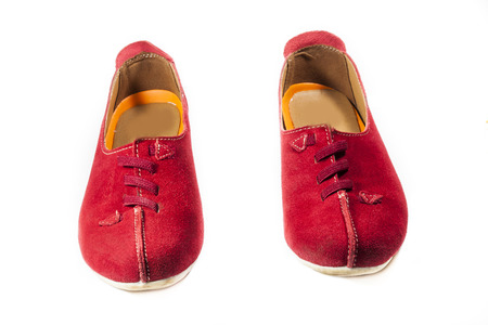 Bright red shoes on a white background.の写真素材