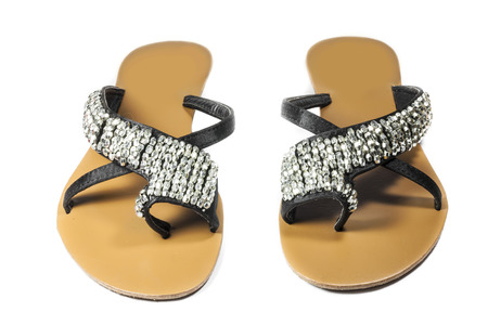 Women's shoes leather black sandals and crystal on a white background.の写真素材