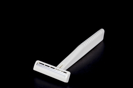 shaving razor on a black background の写真素材
