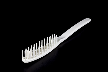 Comb on black backgroundの写真素材