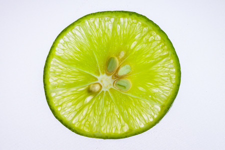 Fresh limes on a white background.の写真素材