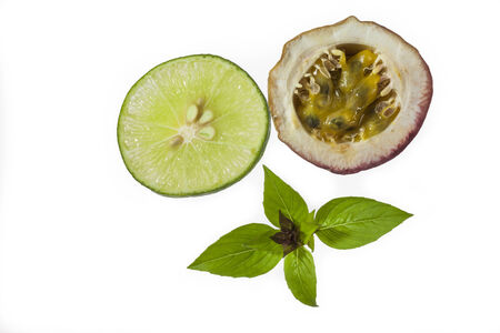 Fresh passion fruit and Fresh limes  on white backgroundの写真素材