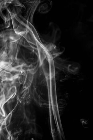 White smoke on black backgroundの写真素材