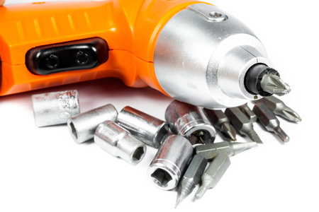 Cordless Drill with different tips on white backgroundの写真素材