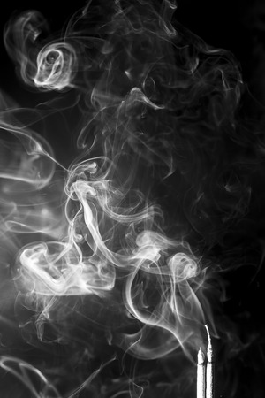 White smoke on black backgroundの写真素材