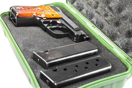Small handgun 6.35 mm. on white background.