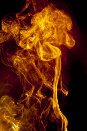Gold smoke on black backgroundの写真素材