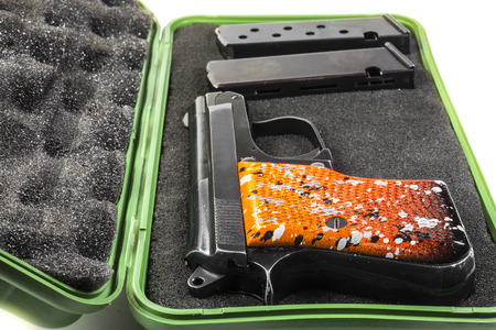 Small handgun 6.35 mm. on white background.の写真素材