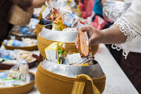 Buddhist merit. monk s alms bowl in thailandの写真素材
