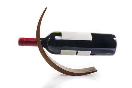 Wine bottle wooden  holder on white の写真素材