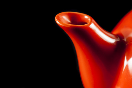Kettle orange on black background. の写真素材