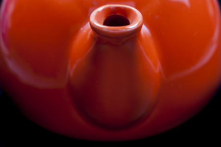 Kettle orange on black background.の写真素材