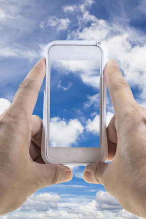 Smart phone taking sky photo.の写真素材