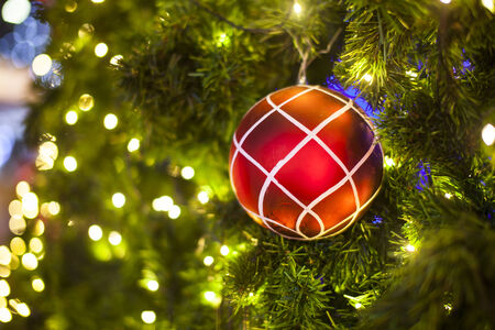 Christmas Tree decorations lit backgroundの写真素材