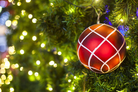 Christmas Tree decorations lit backgroundの写真素材